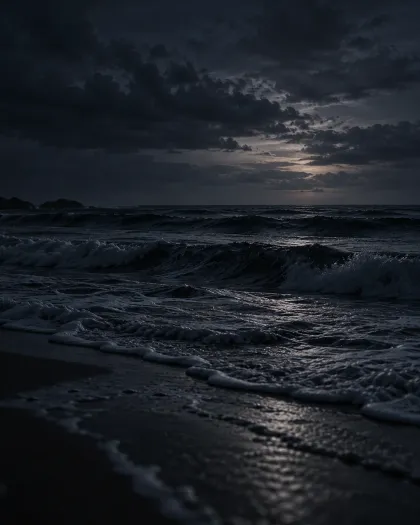 Dark ocean waves rolling toward the shore